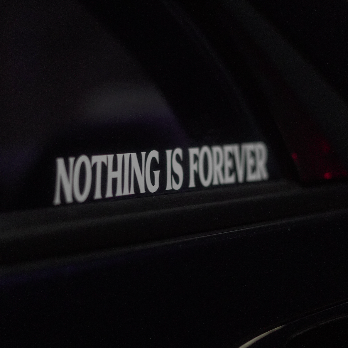 Nothing Is Forever decal on car window