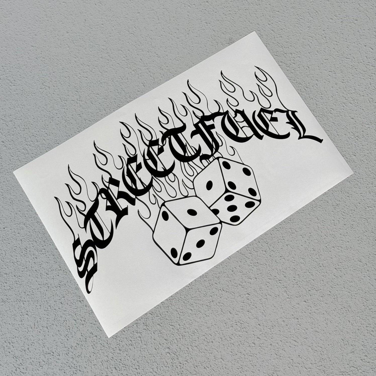 No luck banner sticker with dice and flames design.