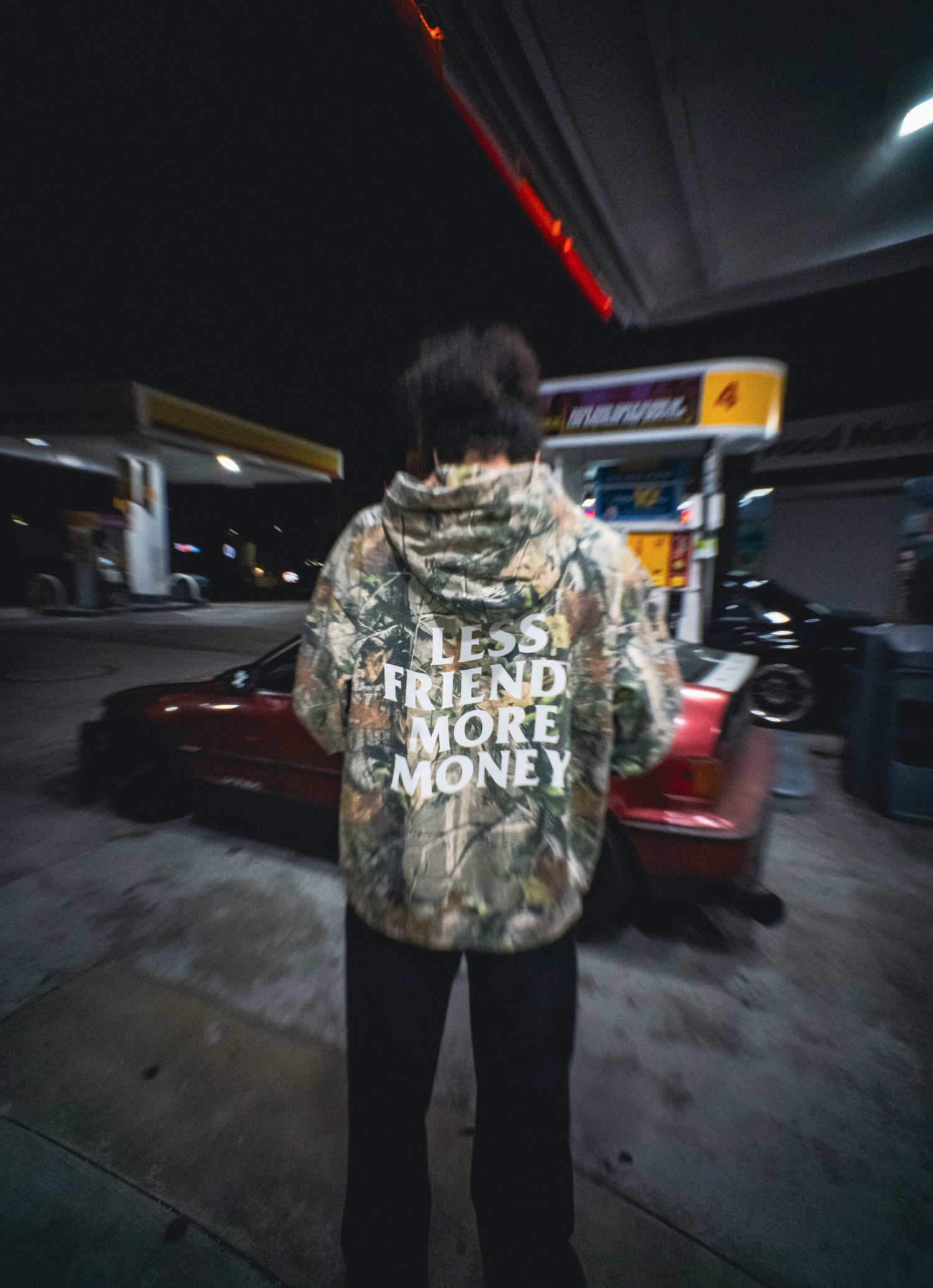 Less Friends More Money Camo hoodie lifestyle shot