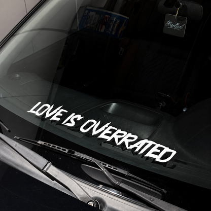 Love Is Overrated rear window vinyl banner on car