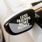 Less Friends More Money vinyl decal on car window