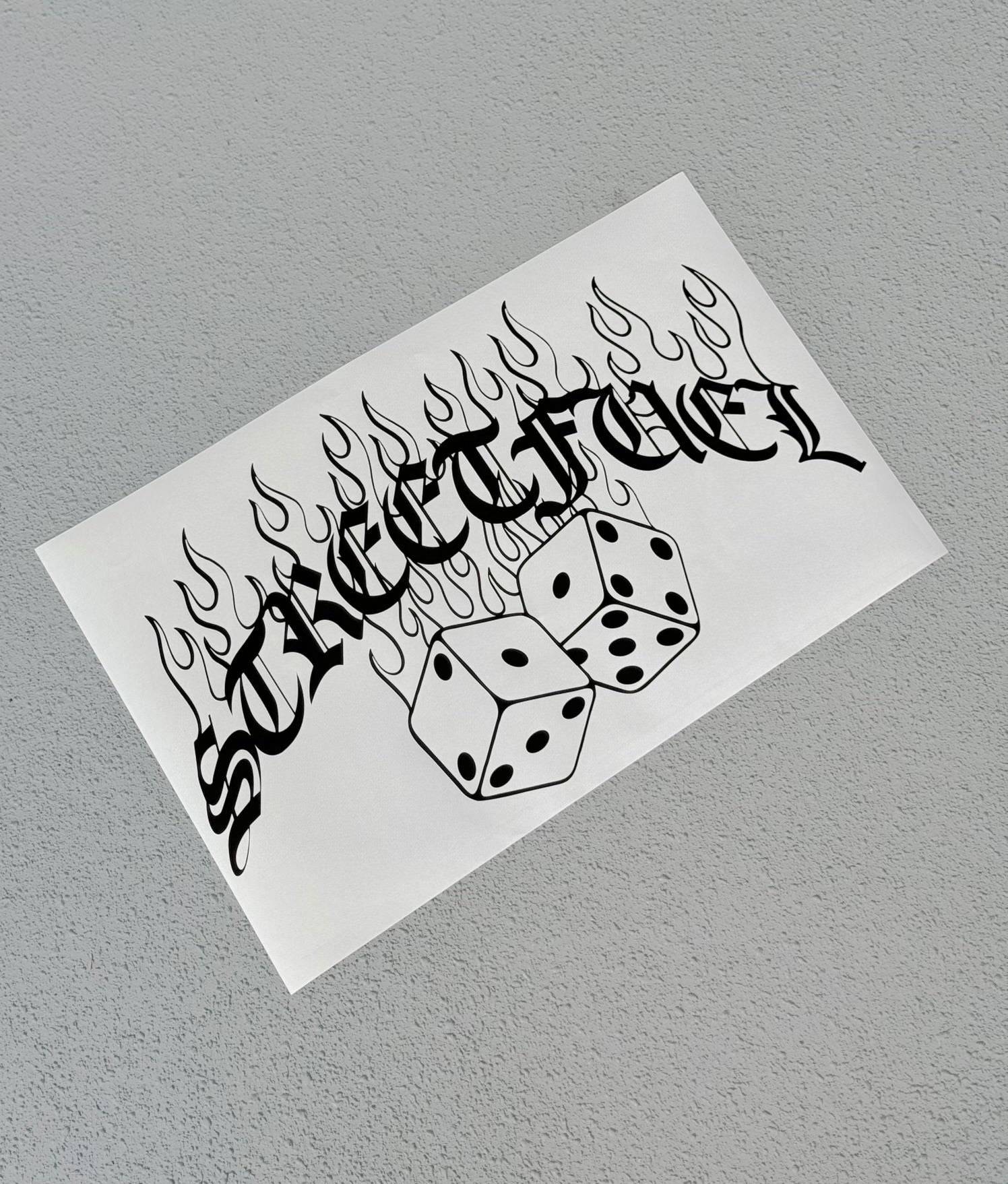 No luck banner sticker with dice and flames design.