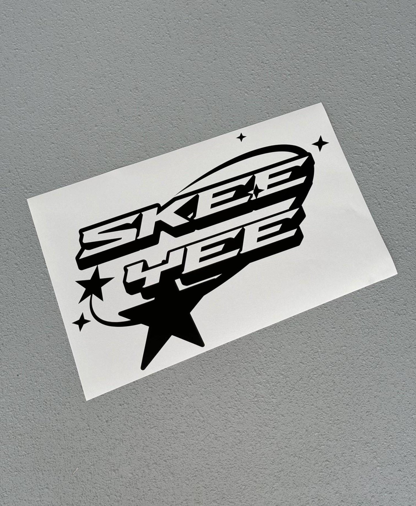 Skeeyee sticker in gloss white on paper